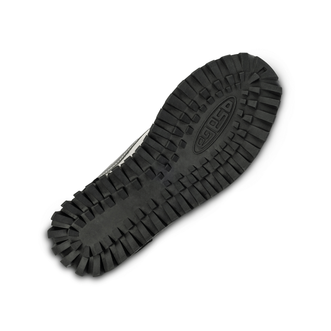 Black waffle rubber sole of a shoe with the logo Osaga imprint on a white background